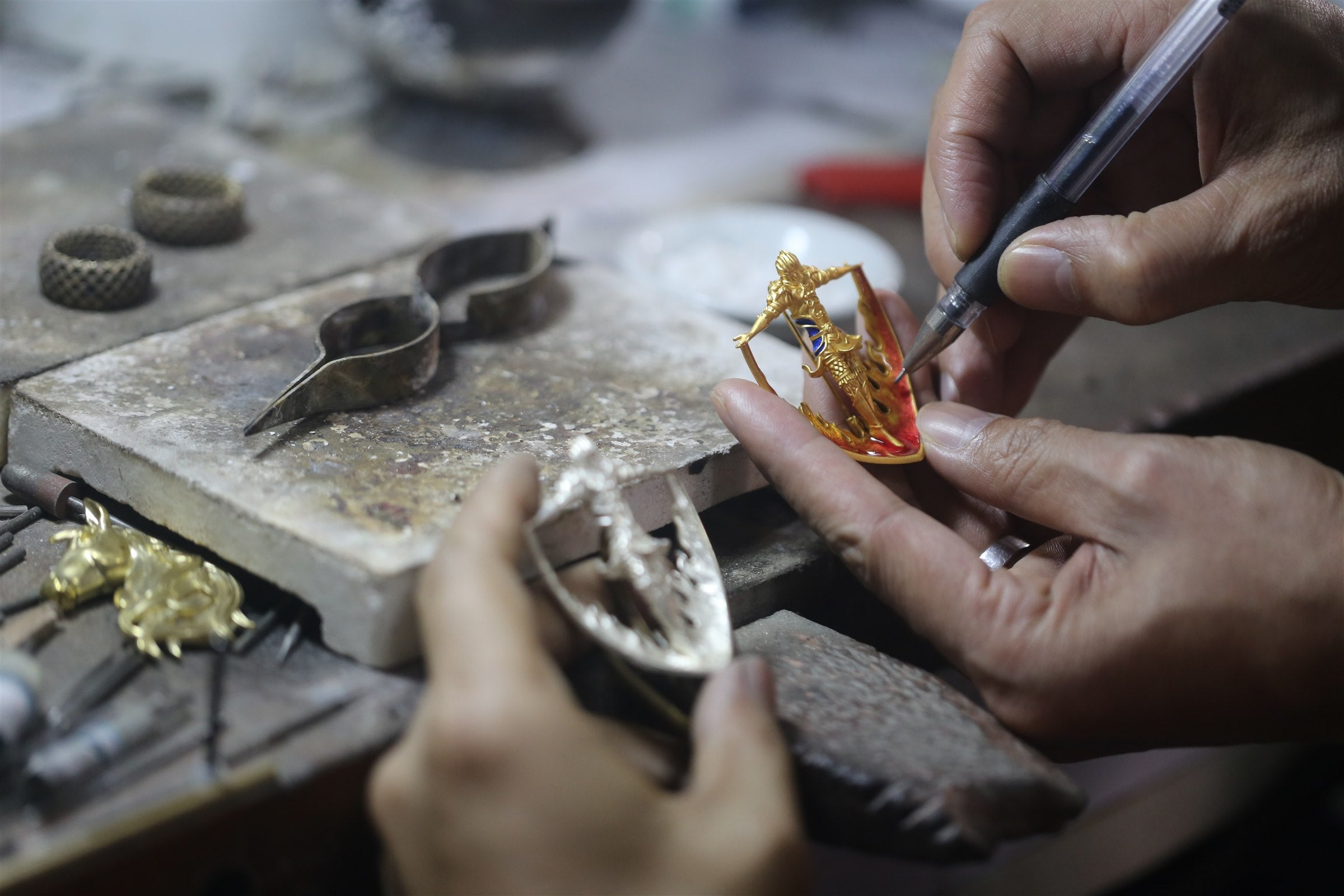 Artisan completing the Garuda pendant by hand