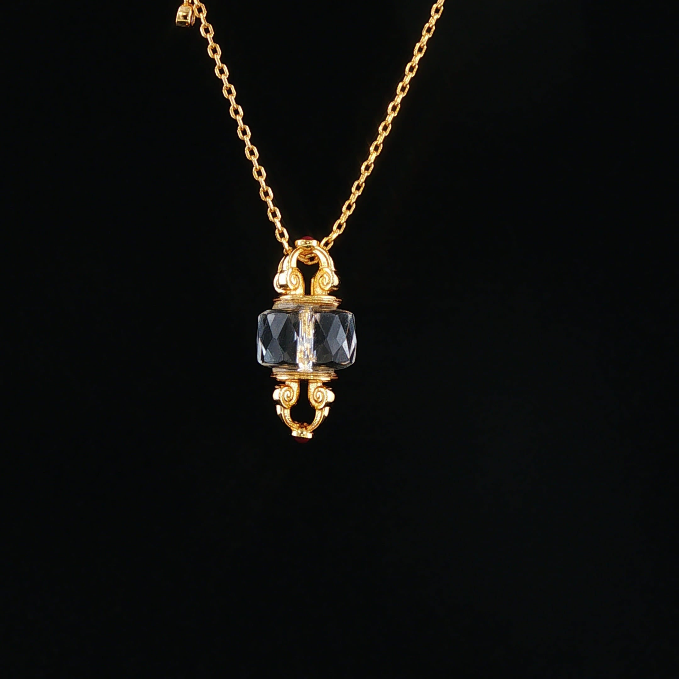 Crystal Axis necklace on a dark mineral background